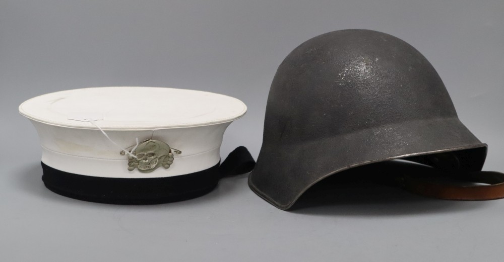A WWII helmet and a sailors cap